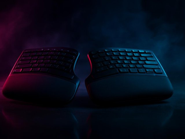 Split ergonomic keyboard with contoured wrist rests